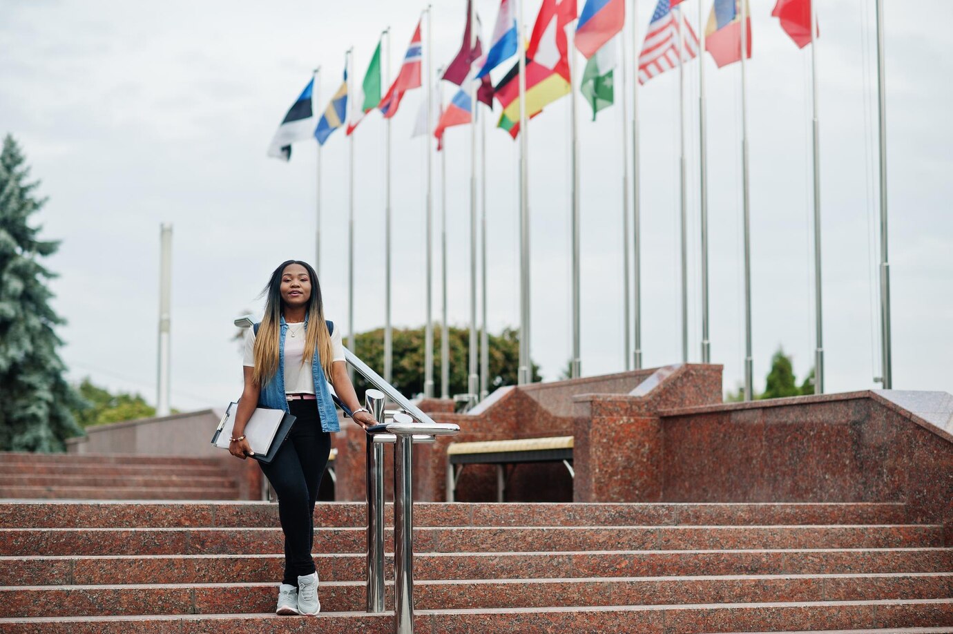 african student female posed with backpack school items yard university against flags different countries 627829 5976